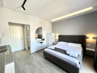Modern double bed and interior of the Deluxe Double Room with Sea View — thumbnail