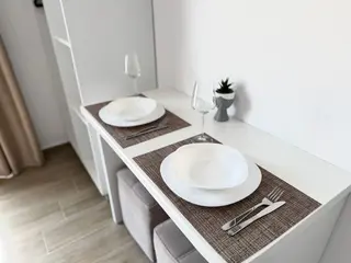 Dining table prepared for two in the Deluxe Double Room with Balcony — thumbnail