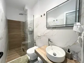Private modern bathroom in the Deluxe Double Room with Balcony — thumbnail