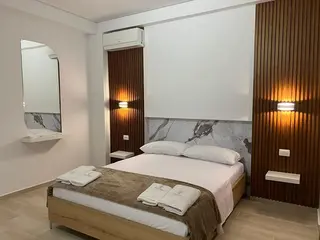 Alternate view of the bed in the Double Room with Mountain View — thumbnail