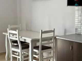 Dining table inside the Triple Room with Sea View — thumbnail